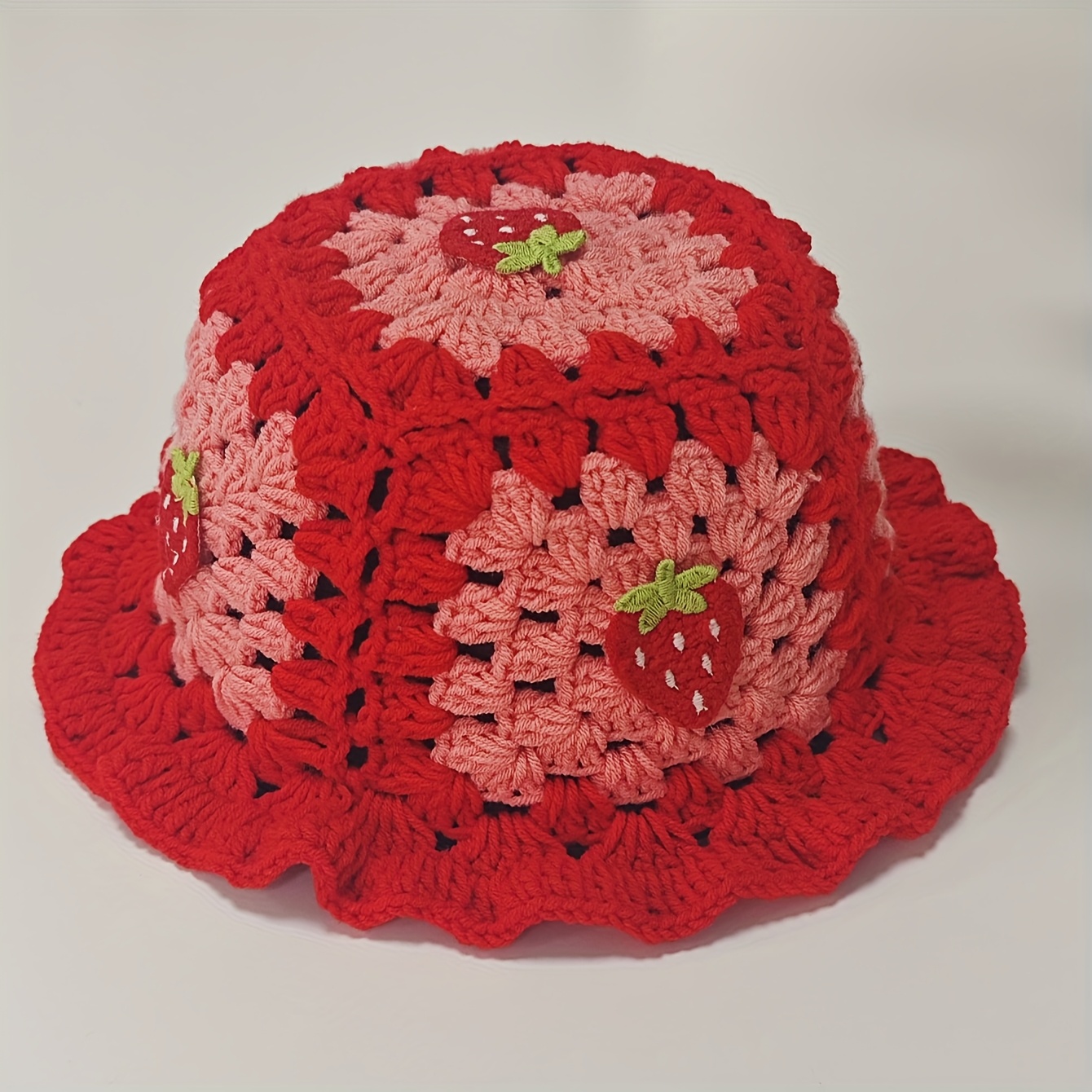 A Versatile Hand-crocheted Hat With Decorations, Featuring Strawberry Accessories