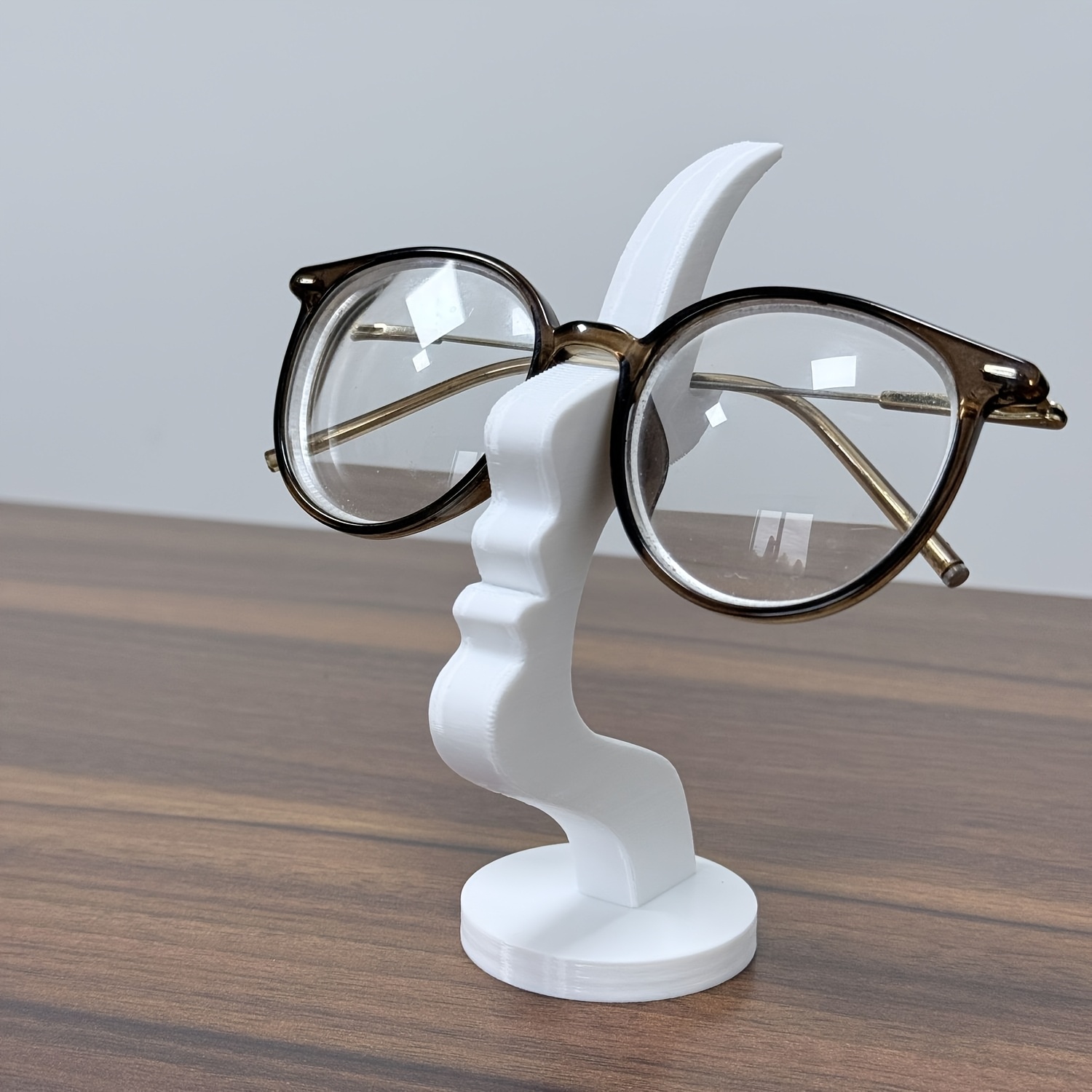 sturdy eyeglass holder curved eyewear organizer stand with anti slip base space saving desk or nightstand decor minimalist black glasses display for home office or gift compatible with eyeglasses and fashion glasses home use