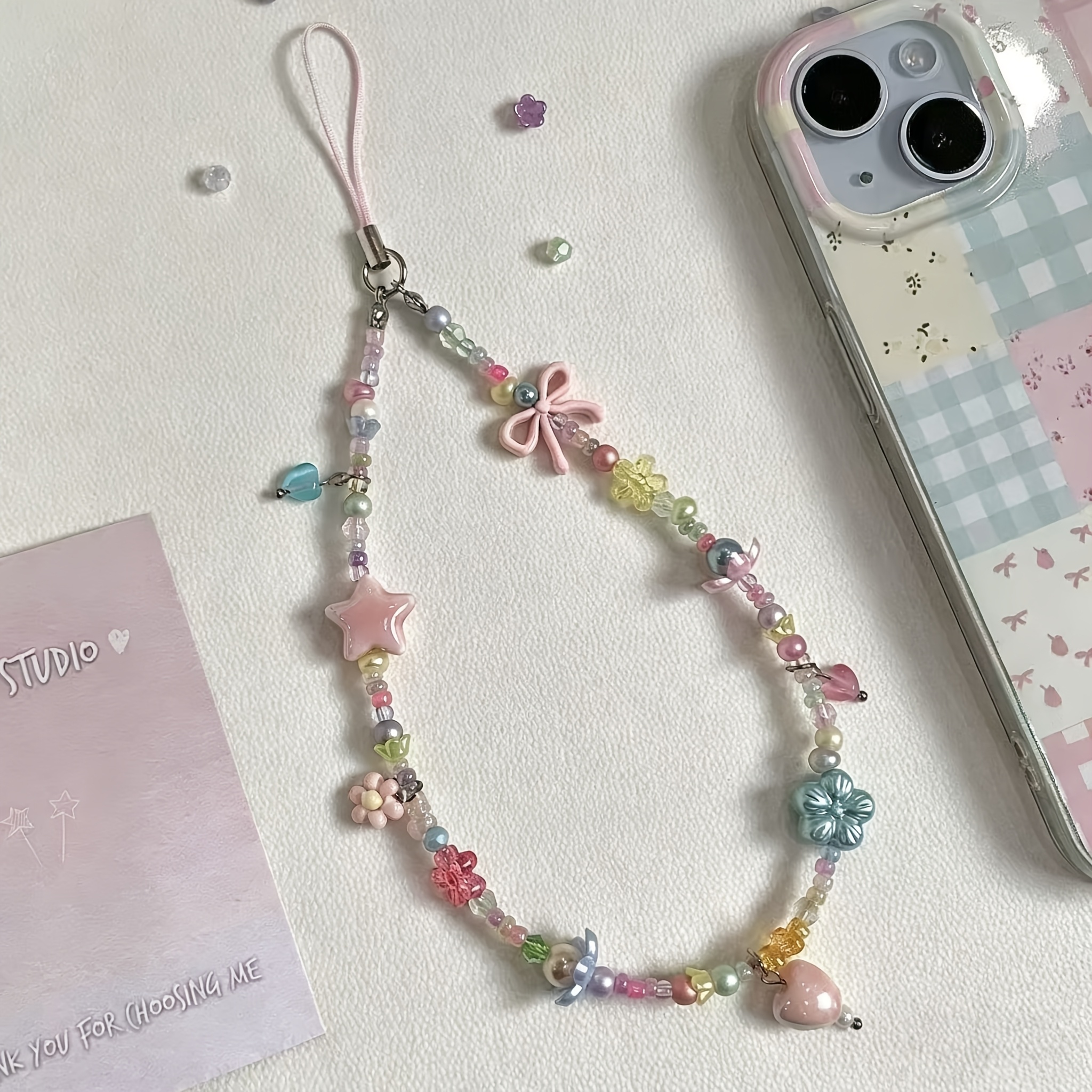 TEMU 1 pieza Cordón para teléfono con cuentas de estrellas y flores color caramelo , correa de muñeca antípérdida, colgante versátil para cámara y