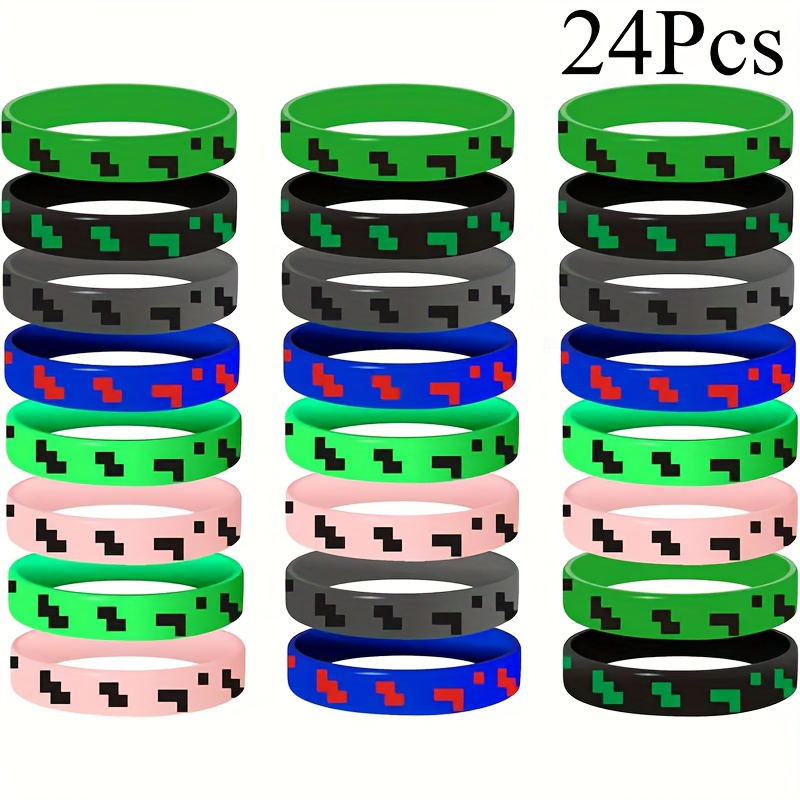 E-shop 24 Pixel-Silikonarmbänder mit Spielinspirierten Prints, entworfen -Video-Spiel-Ästhetik. Diese farbenfrohen elastischen Bänder sind für