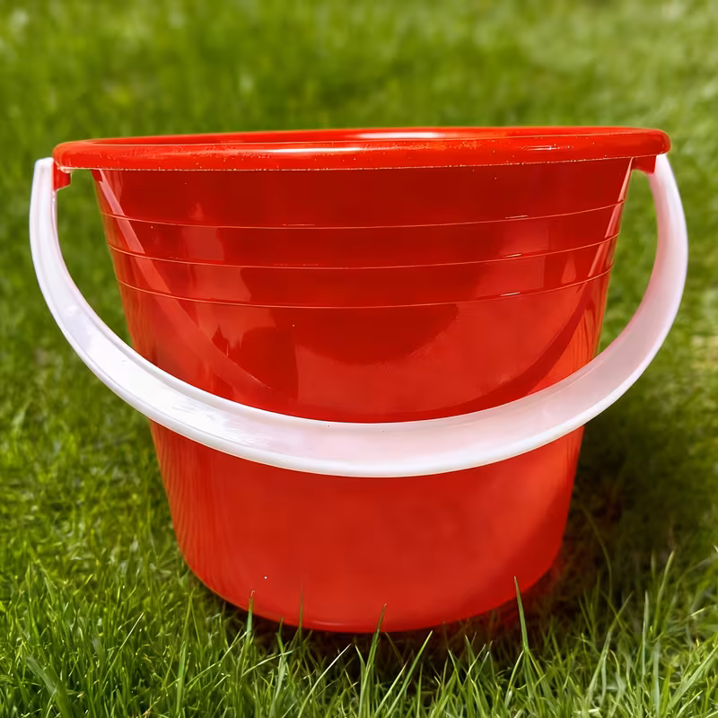 mini red handheld bucket ideal for outdoor water carrying beach sand play small item storage plastic material versatile for living room outdoor furniture bathroom use Product details 1
