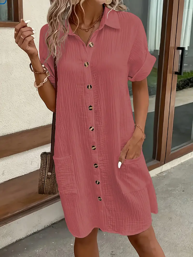a minimalist white shirt dress made of breathable featuring a sharp collar design and buttons that add a touch of details 3