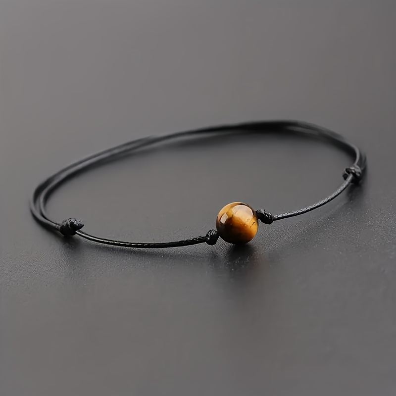 An Adjustable Bracelet Made Of 8mm Eye Stone For Men And Women