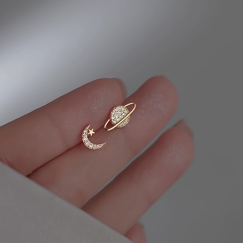 Image of A Pair Of Star And Easy Planet Asymmetrical Earrings For Women