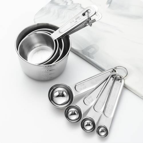 an 8pcs silvery measuring cup and spoon set
