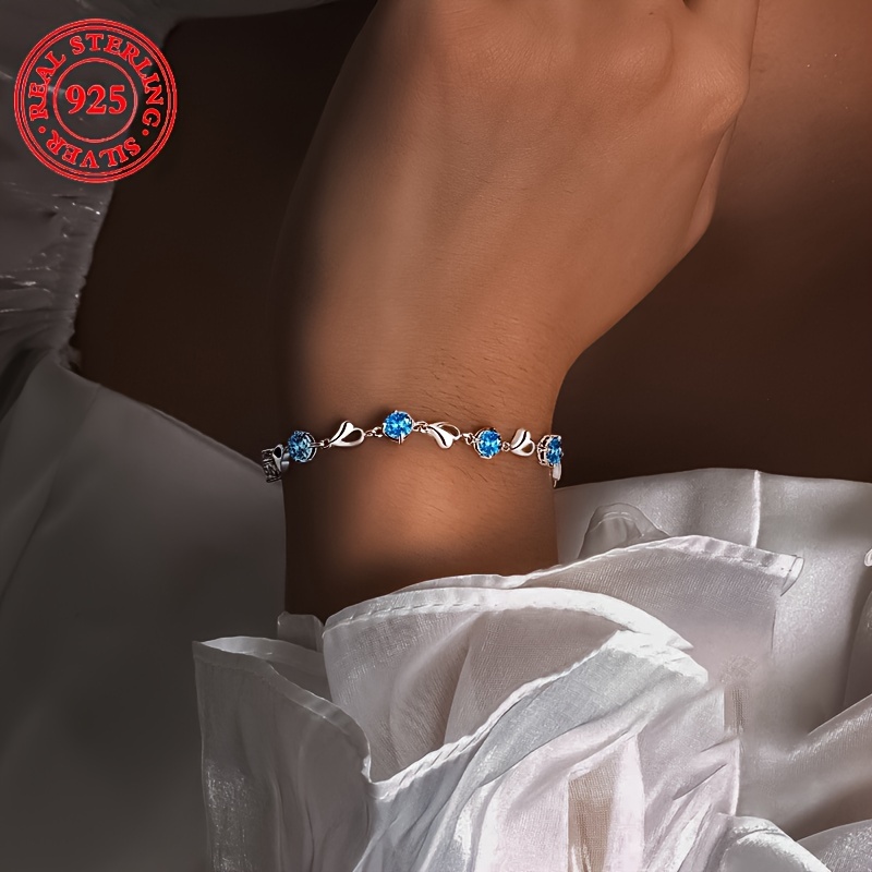 

A Stylish Bracelet For Women, Featuring With Blue Synthetic Zirconia Inlaid In A -shaped Bracelet Made Of 925 Silver, Weighing 5.5 Grams. Or As A Gift For .