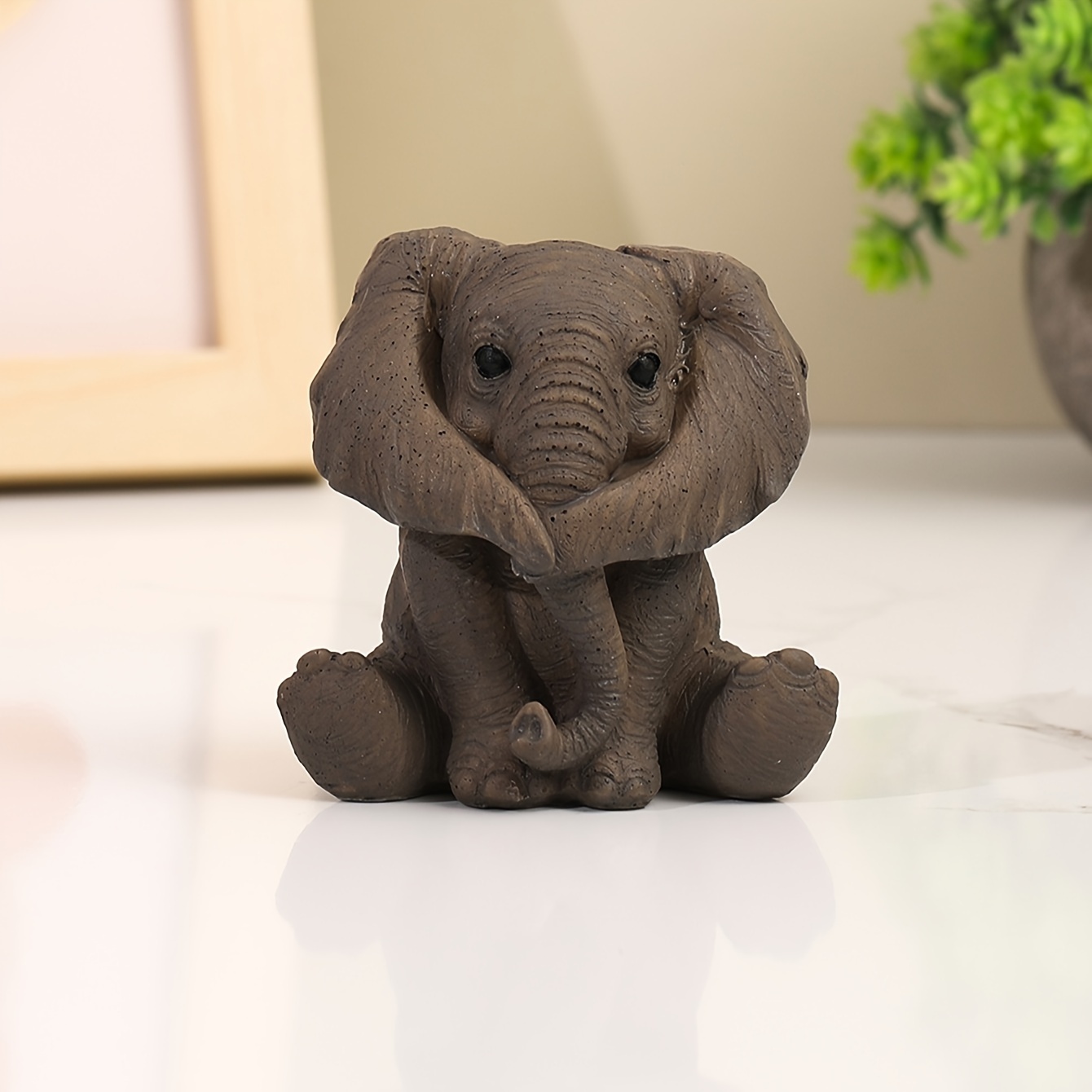 

1pc Adorable Sitting Elephant Figurine, Resin Craft, 3.15in Rustic Brown Collectible Ornament, Home & Office Desk Decor, Animal Statue
