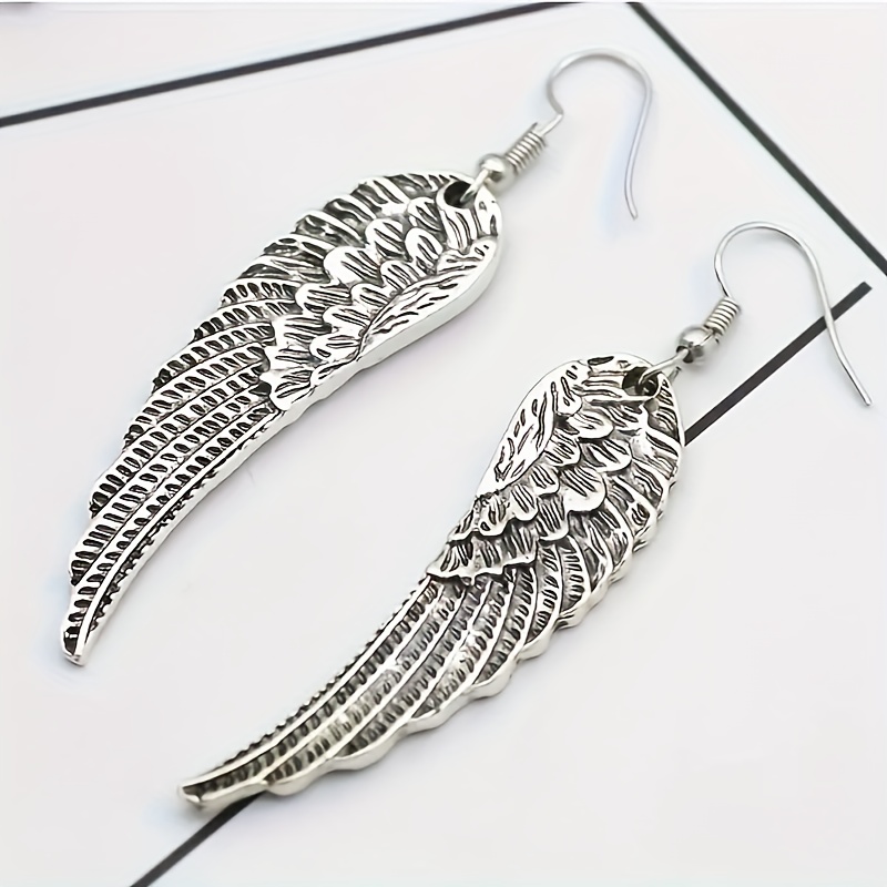 Image of A Set Of Unisex Vintage Earrings Featuring Dangling Wings - Trendy Punk Gothic Feather Jewelry Perfect For Parties And Gifts - An Ethereal