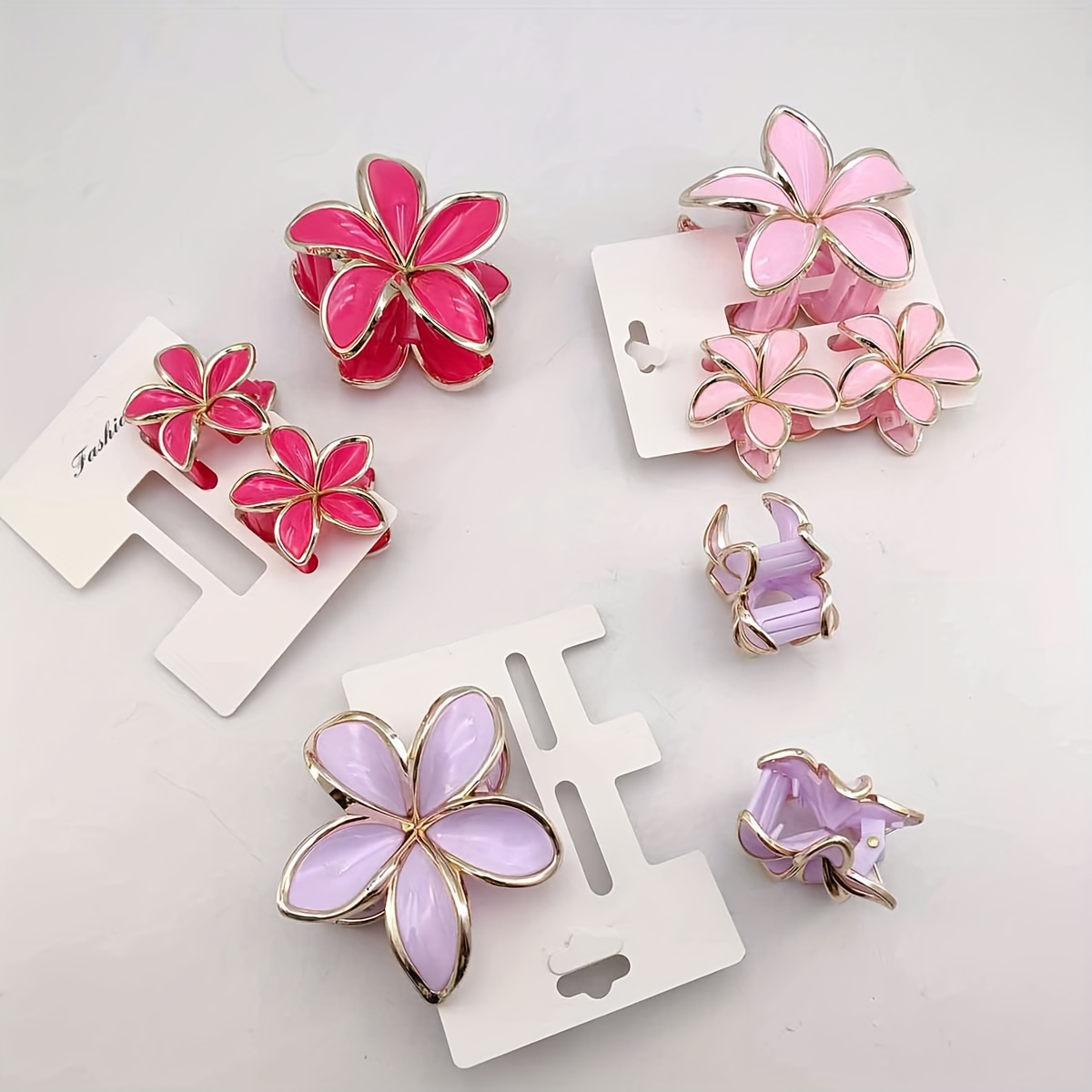 3 carded gold simulated frangipani plastic hair claw - Temu Oman