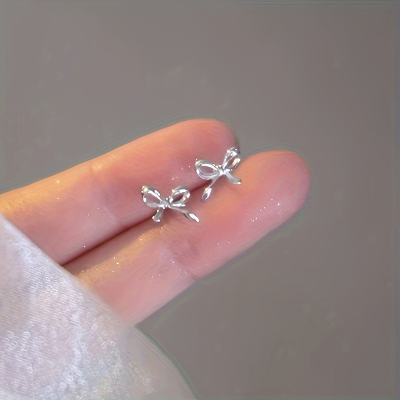 

Silvery Plated Needle Bow Earrings With Elegant And Butterfly Design Earrings, Fashionable And Elegant Earrings