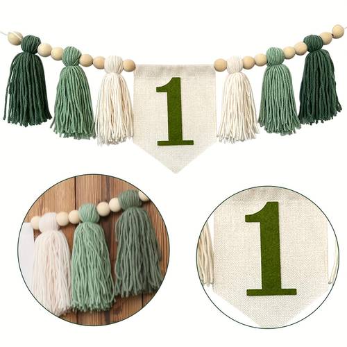 a handmade green high chair banner with dark green tassels and a pull suitable for jungle wildlife themed birthday party decorations