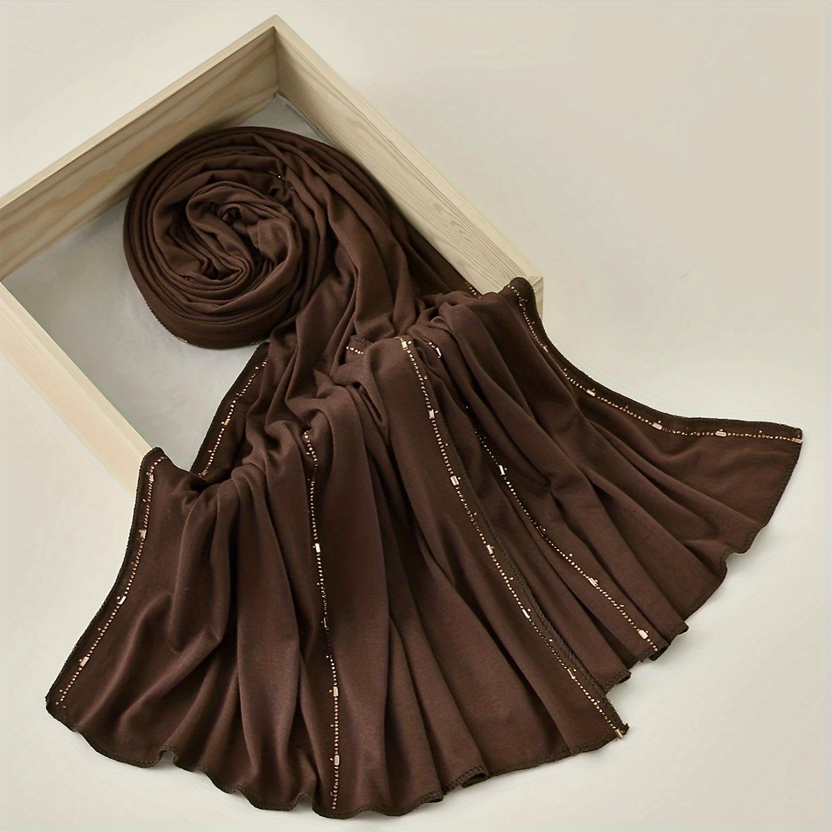 New Modal Solid Color Rhinestone Long Scarf Headscarf, Suitable for Muslim Women to Wear as a Hijab. Made of High-quality, Breathable, and Soft-touch Fabric, Available in Four Classic and Attractive Colors: Black, White, Khaki, and Coffee. Ideal for