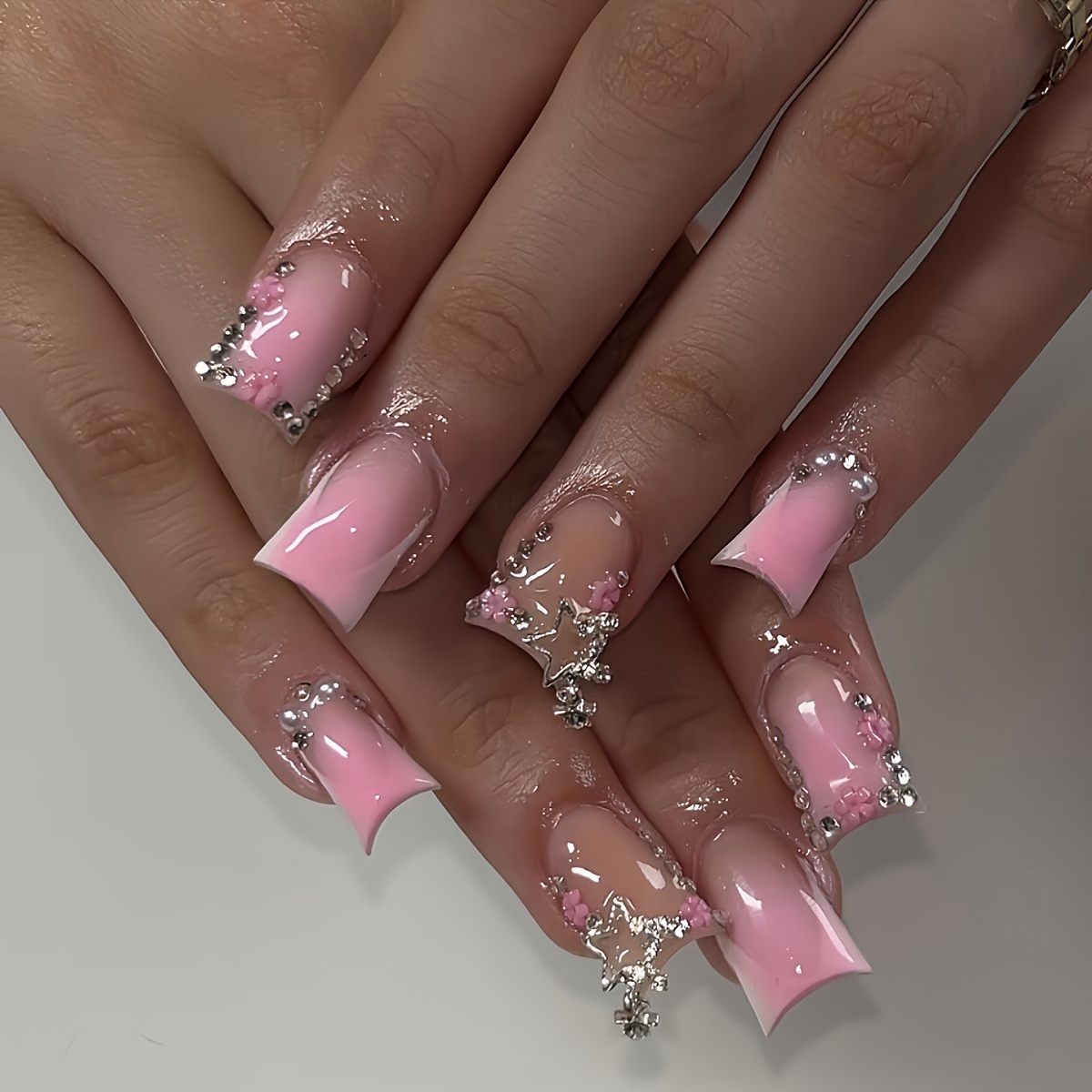 

Pink Ombre Dagger Nails With Waterfall Rhinestones And Star Charms - Perfect For A Festive Look!