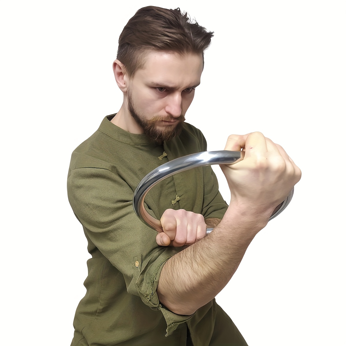 A man training with a wing chun stainless ring sold by 100 Spartans