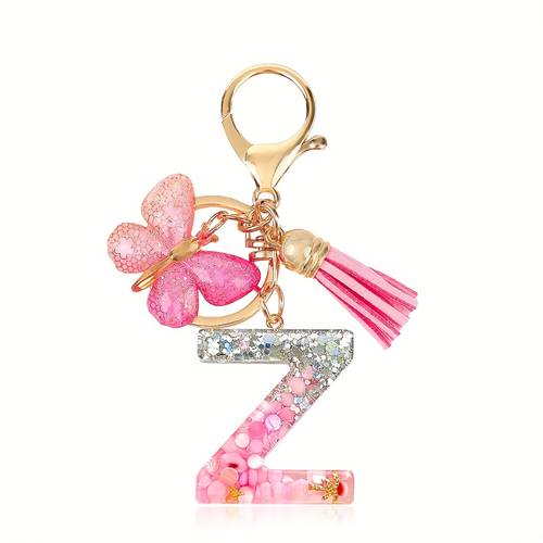 one keychain featuring a key ring with glitter and a tassel pendant hanging on bags and suitable for car keys and womens purses