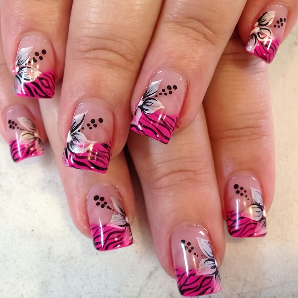 Image of Set Of 24 Short Square Fake Nails With A Nail File And For Nail Art, Featuring Black , Pink French Tips, And White Floral Patterns. This Easy, Stylish, And Use