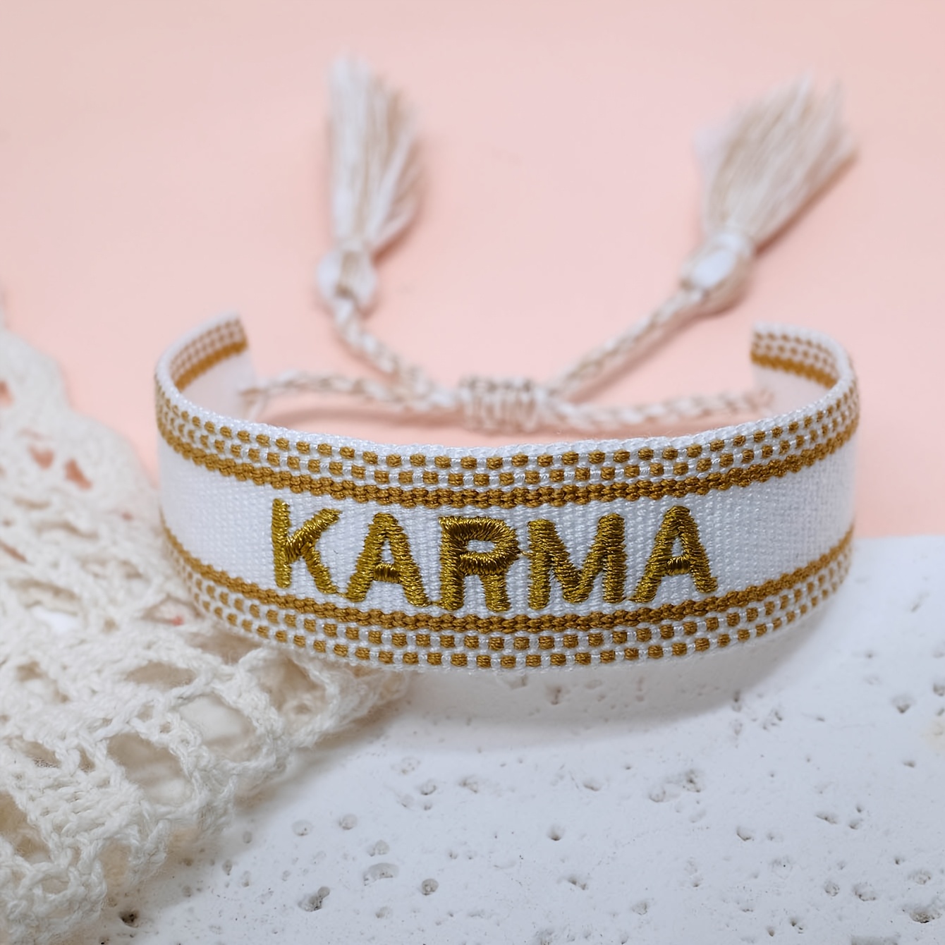 A Handmade Bracelet Featuring 'karma', Creatively Woven With Tassels And Adjustable Size, Making It A