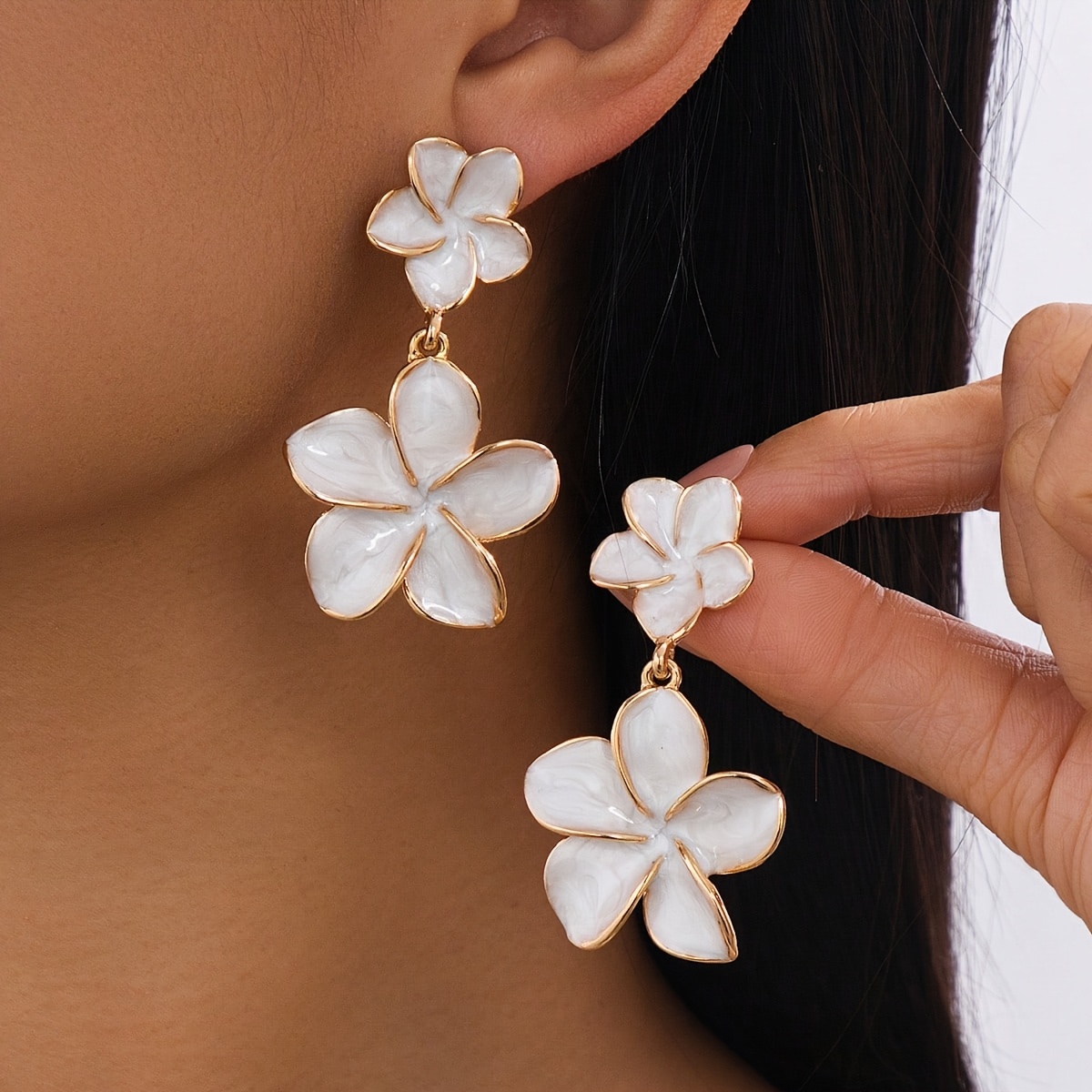 white flower earrings sold on Temu Canada