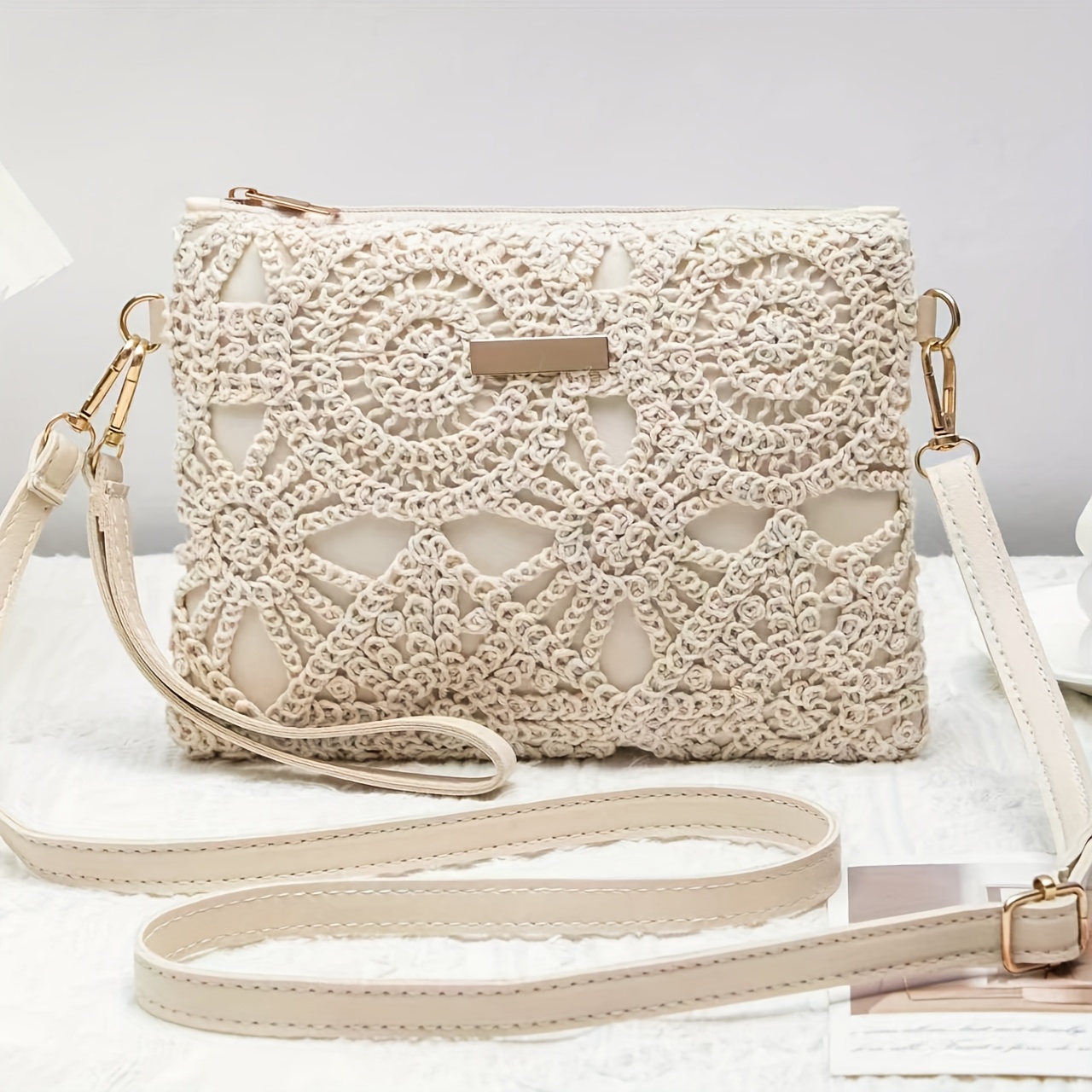 Image of An Elegant Crossbody Bag Featuring Intricate White Patterns, With A Easy Nude Strap, Showcasing A Feminine Charm. Perfect For Spring And Summer, It Easily Dresses Or Casual Outfits. Not Washable