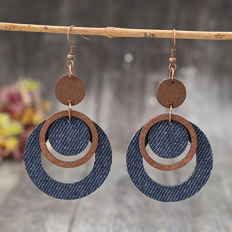 Image of A Pair Of Vintage Western Cowboy Style Round Hollow-out Pu Wood Creative Women's Earrings