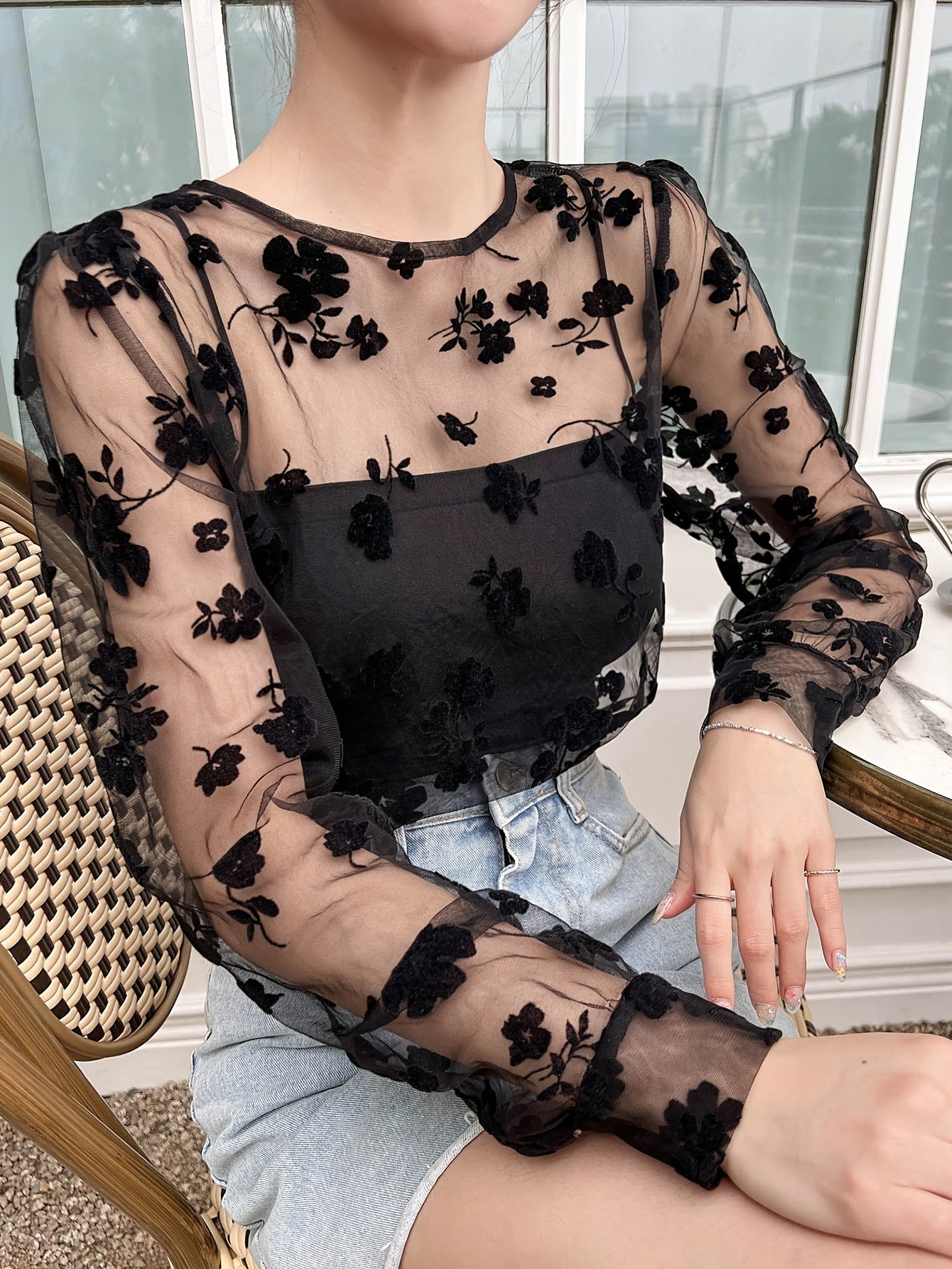 sheer black top with floral embroidery