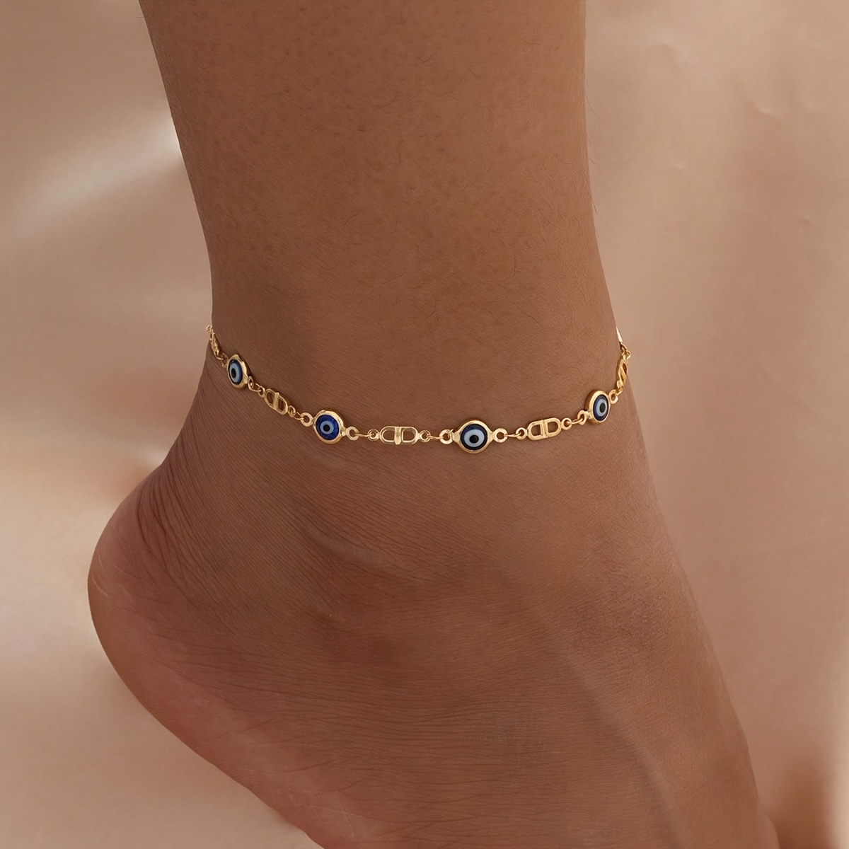 

A Minimalist Style Women's Anklet Featuring A Trendy Evil .