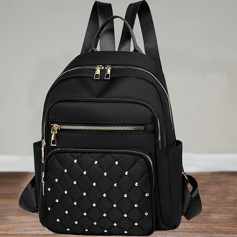 

Sac à Dos Noir en Nylon pour Femmes avec Design Matelassé & Accents de Rivets - Grande , Léger, Bretelles Ajustables pour la Quotidienne & , Sac à Dos de Voyage