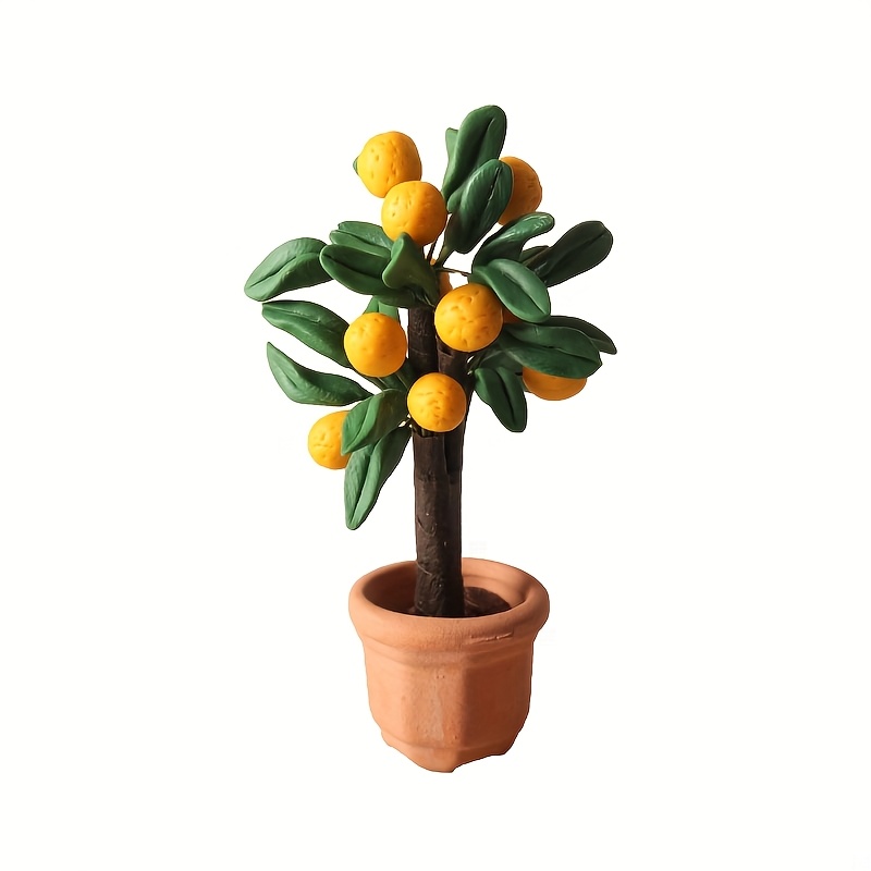 Miniature Orange And Pear Trees And Clay Plants As Ornaments