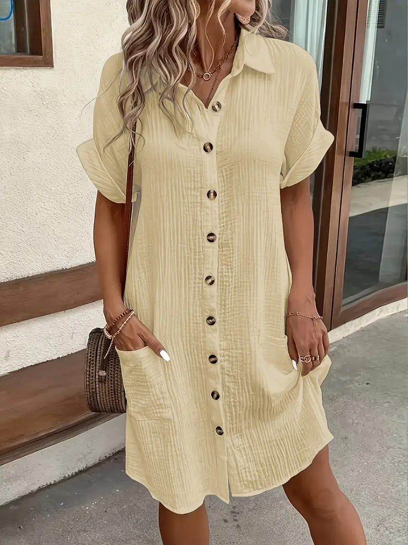 a minimalist white shirt dress made of breathable featuring a sharp collar design and buttons that add a touch of details 5