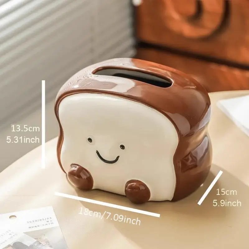 visually appealing toast shaped ceramic tissue box holder smiling bread design with pink flower detail accents living room bedroom or kitchen decor Product details 2