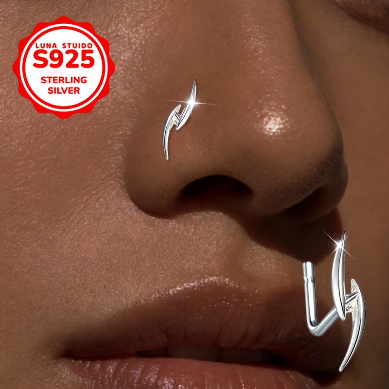 Image of A Women's Nose Stud Made Of S925 Silver Hypoallergenic. It Has An L-shaped Bar, A Hook, And A Spiral Blade Design, Unique Industrial Lines With A Gothic Vibe, All While Y2k Fashion