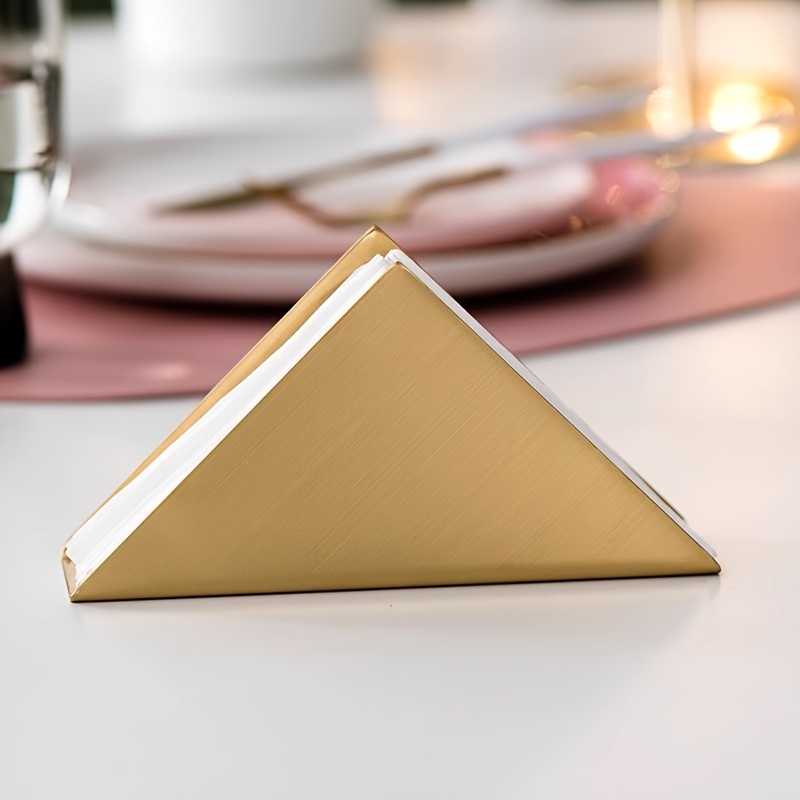 E-shop Ein minimalistischer Serviettenhalter aus Edelstahl. Dieser goldene dreieckige Serviettenständer ist zum Dekorieren von Esstischen, Cafés und