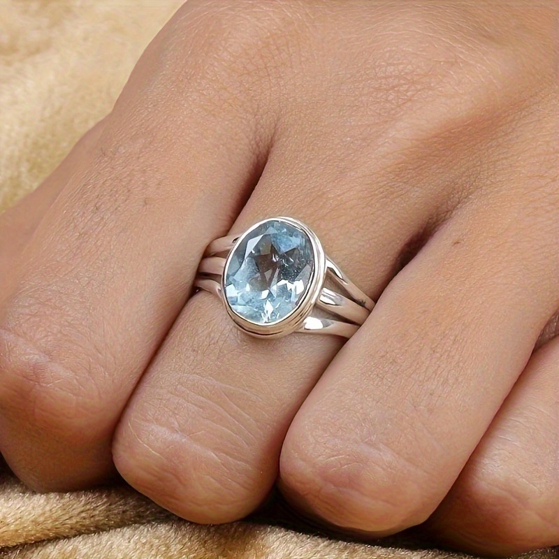 

Silvery Ring With Aquamarine Blue Zirconia Gemstone, Unisex Vintage Style, Ethnic Inspired, , Fashion Jewelry Accessory