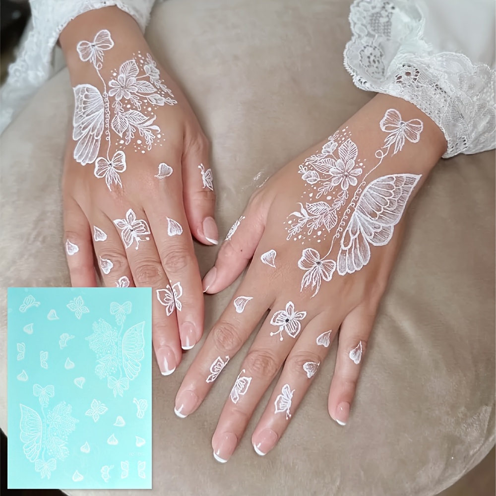 A Single Sheet Of Temporary Waterproof Tattoo Stickers Featuring A White Flower And Lace Design, Perfect For Women And Ideal For Body Art