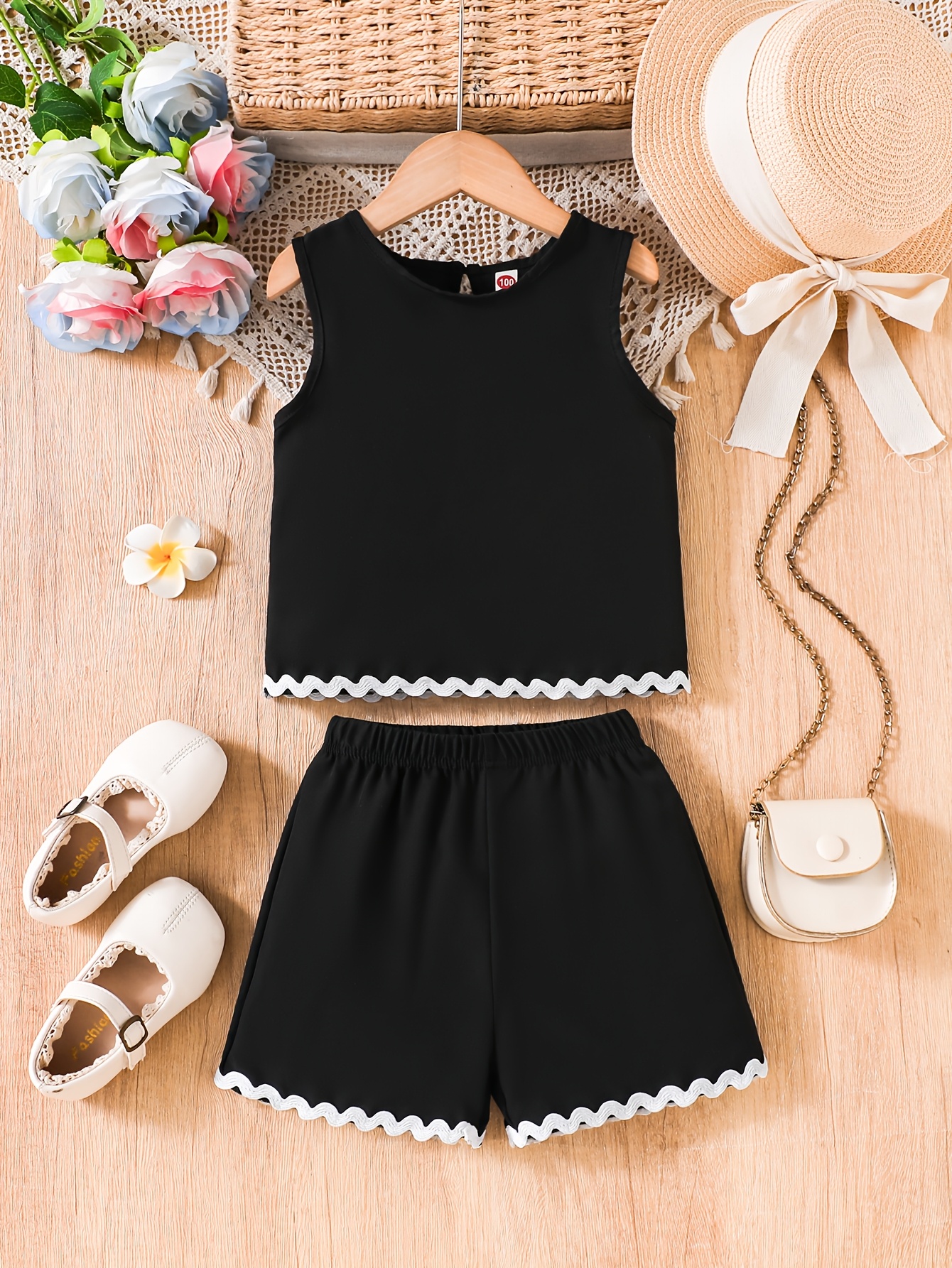 a 2pcs summer outfit girls featuring a sleeveless t shirt a