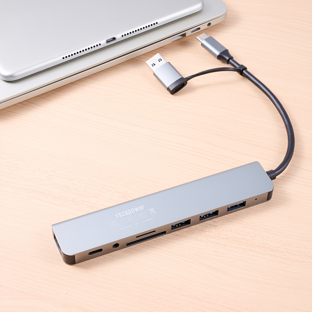 an 8 in 1 multifunctional docking station with a usb c a supporting high speed usb 3 0 transfer it a tf sd card reader and a 3 5mm headphone jack making it lightweight and portable suitable for devices like laptops and smartphones expanding options and enhancing work details 2
