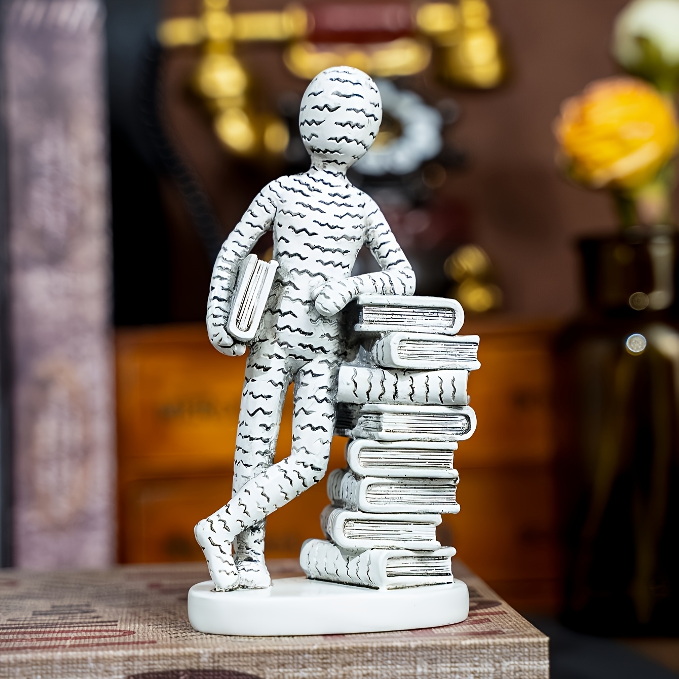 TEMU 1pc Creative Abstract Figure Reading Sculpture, Available In Golden/white/red. The Figure Against A Stack Of Books While Holding A Book, With