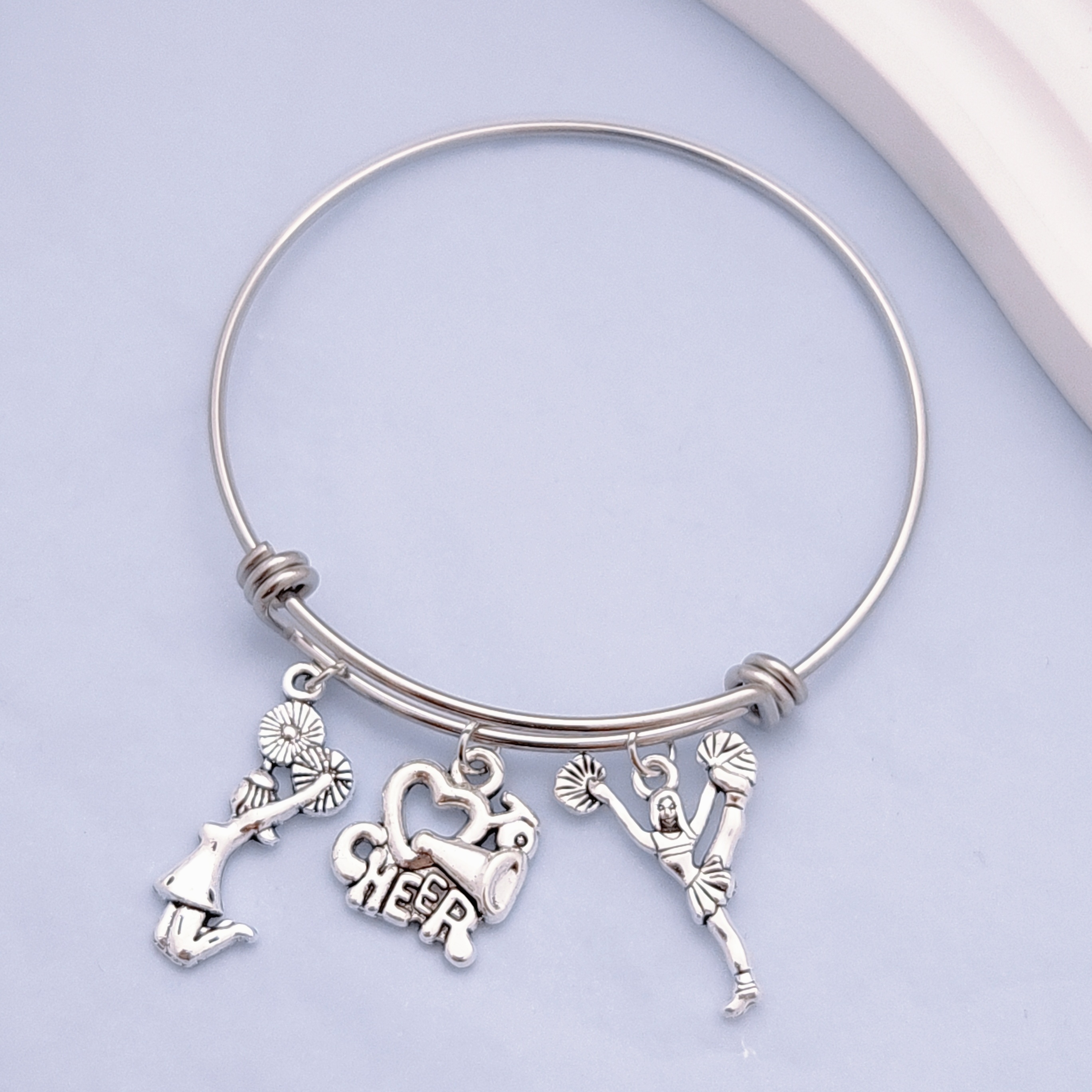 

Sporty Stainless Steel Adjustable Bangle With Cheerleading Charms, No Plating, Cheerleader Accessory For Daily Wear And Mardi Gras Celebration - 1 Size Fits All