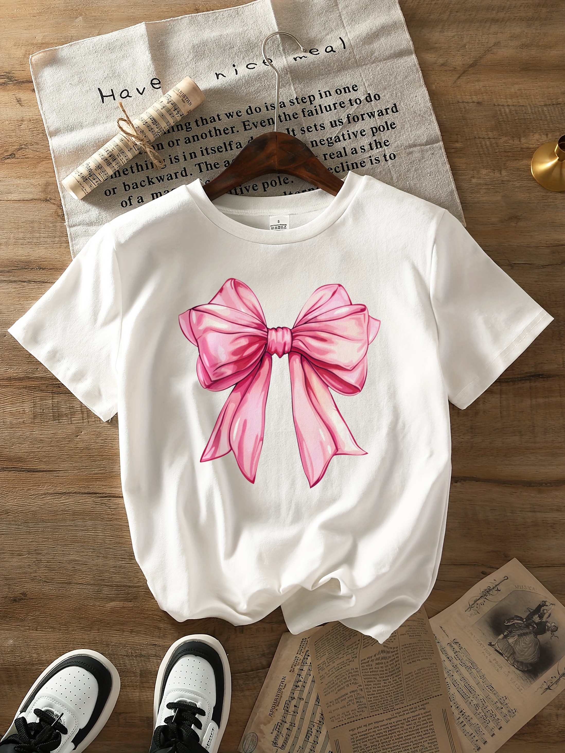 Women's Casual Short Sleeve T-Shirt with Elegant Pink Bow Graphic Print -  Breathable Round Neck Top, Semi-Sheer * Silhouette, Machine Washable \u0026, image size:800x1066