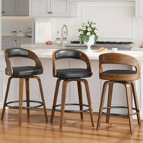 set of 2 contemporary 26 inch bar stools with a counter height featuring ergonomic faux leather swivel seats sturdy wooden legs and a metal footrest designed without for use in kitchens and