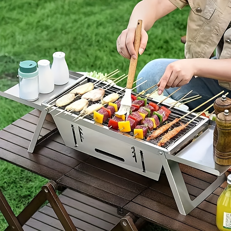 

Portable Stainless Steel Charcoal Grill - Easy Fold, Food-grade, Ideal For Outdoor Camping And Picnics, With Skewer Holders And Condiment