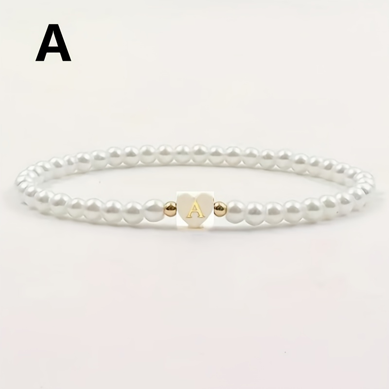 TEMU Pulsera de 1 pieza de de perla falsa con 26 dijes de alfabeto A-Z de cara, estilos para combinar, pulsera de moda para mujer, cordón elástico,