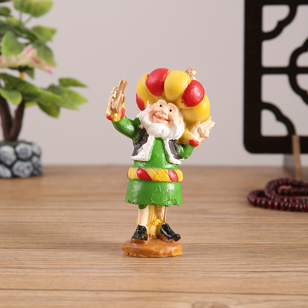 a resin figure of a chubby old man with a cannon suitable for decoration during eid celebrations Product details 4