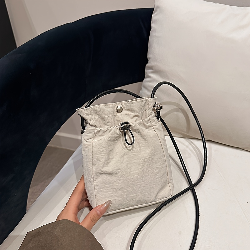 Image of A Women's Crossbody Combines Retro Style With Casual , Featuring A Solid Suitable For Holding A Phone. This Mini Bag Used As A Shoulder Bag, Handbag, Or Coin Purse