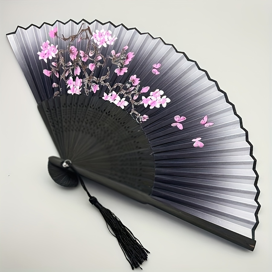 a vintage bamboo folding fan featuring a cherry   motif transitioning from black to purple   with tassels this traditional accessory for chinese hanfu dance is a portable fan for women making it an ideal decorative gift