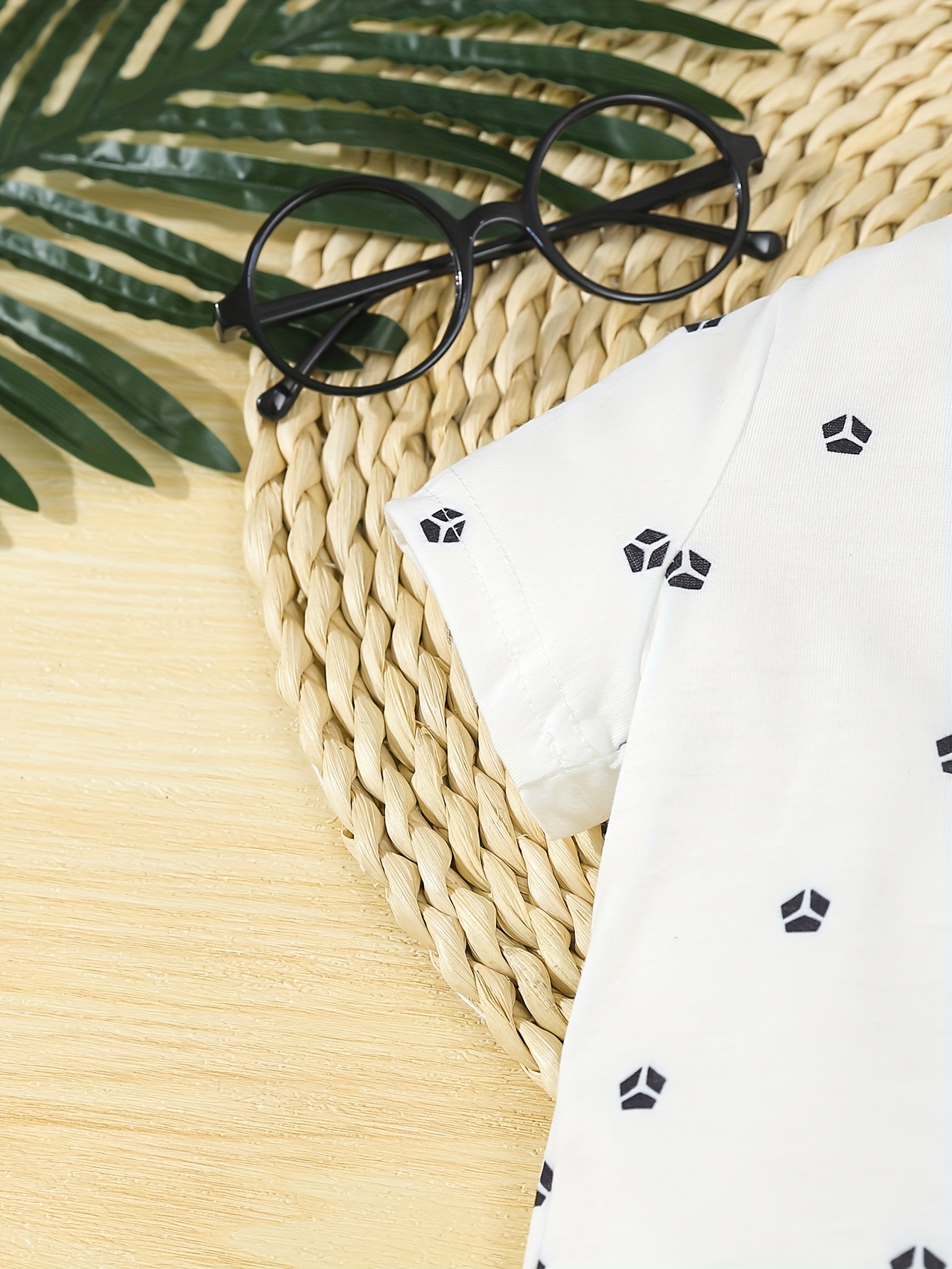 a formal three piece gentleman outfit for baby boys featuring a short sleeve shirt with geometric patterns and a bow tie shorts with suspenders and a   hat stylish and   its a   for summer birthday parties Product details 3
