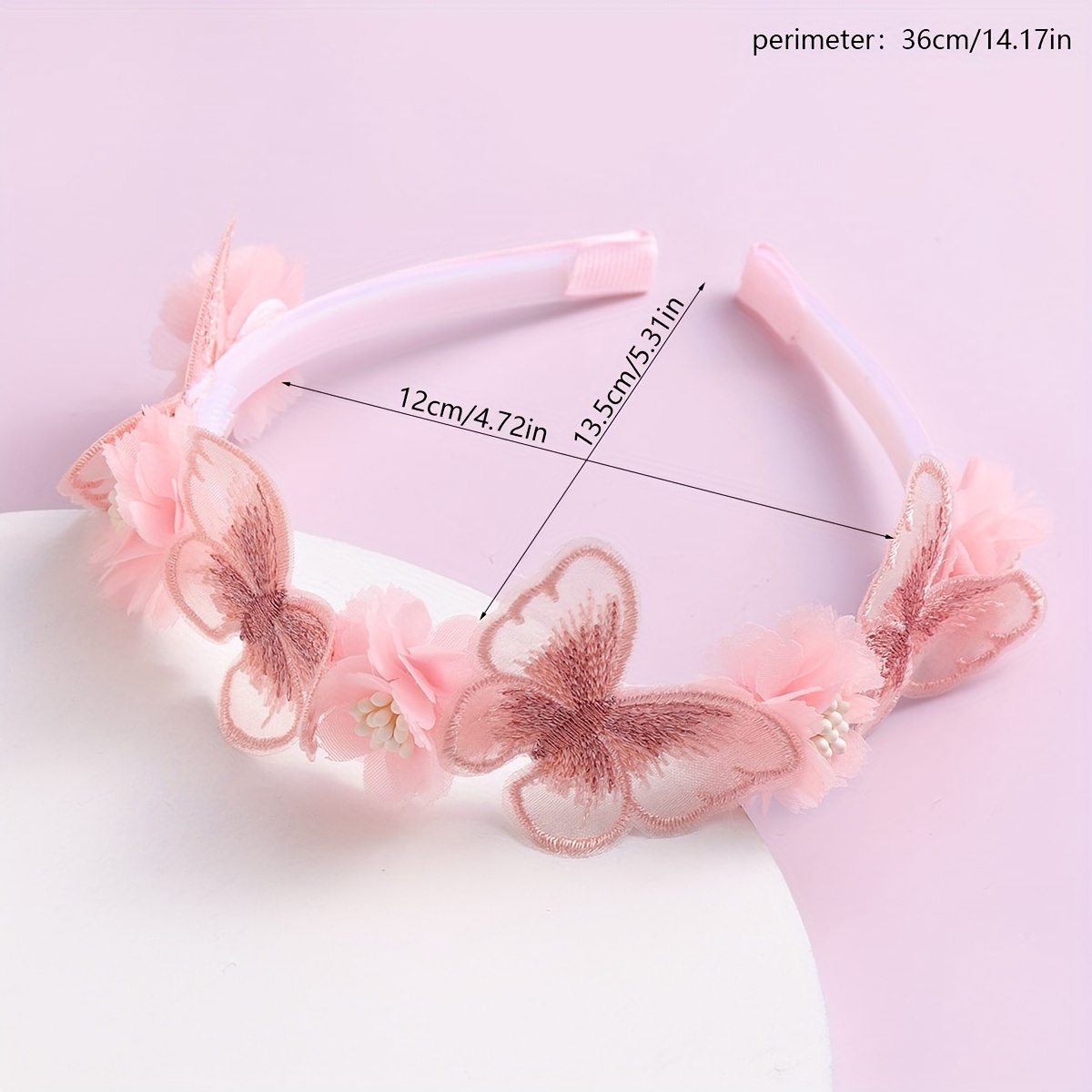 A Headband With Pink Flower Petals And Butterflies
