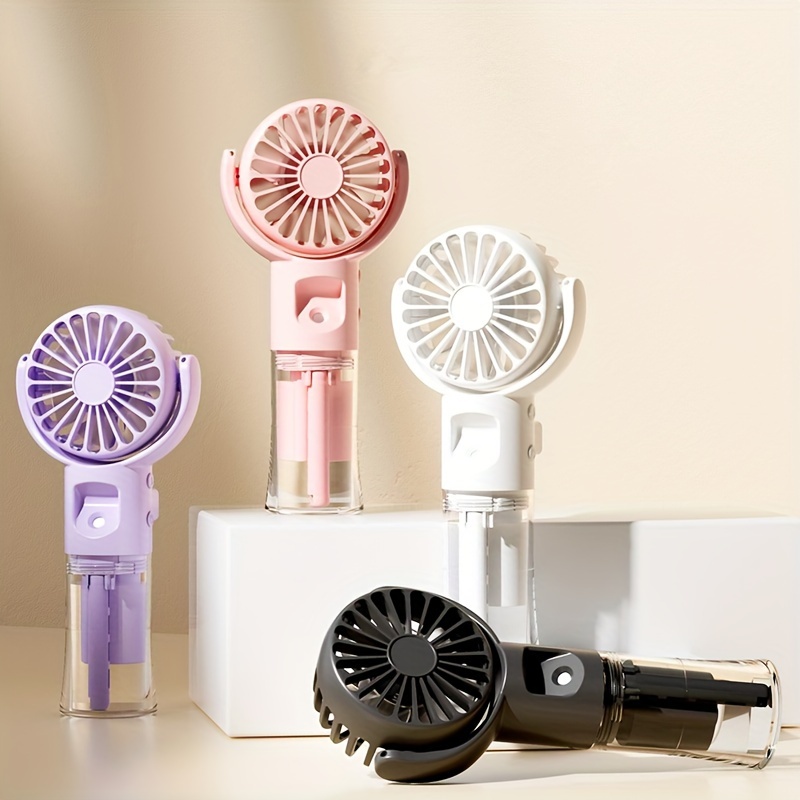 portable handheld misting fan for outdoor use featuring a desktop humidifying function and four adjustable speed settings