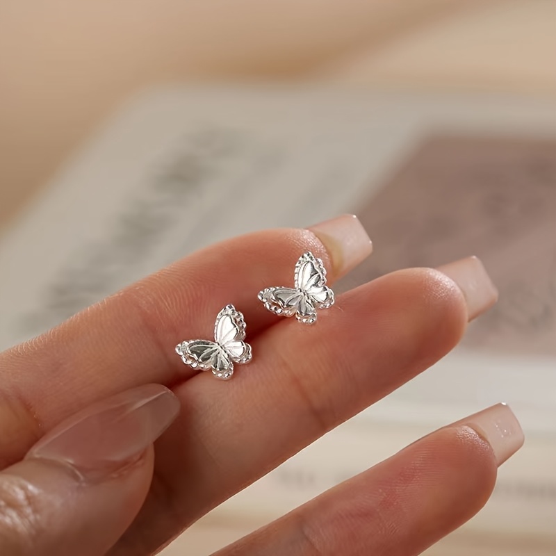 a pair of ladies fashionable hollow   stud earrings with 925 spiral silvery   featuring a silvery plating for a minimalistic light luxury look suitable for daily wear parties vacations and making great gifts Product details 7