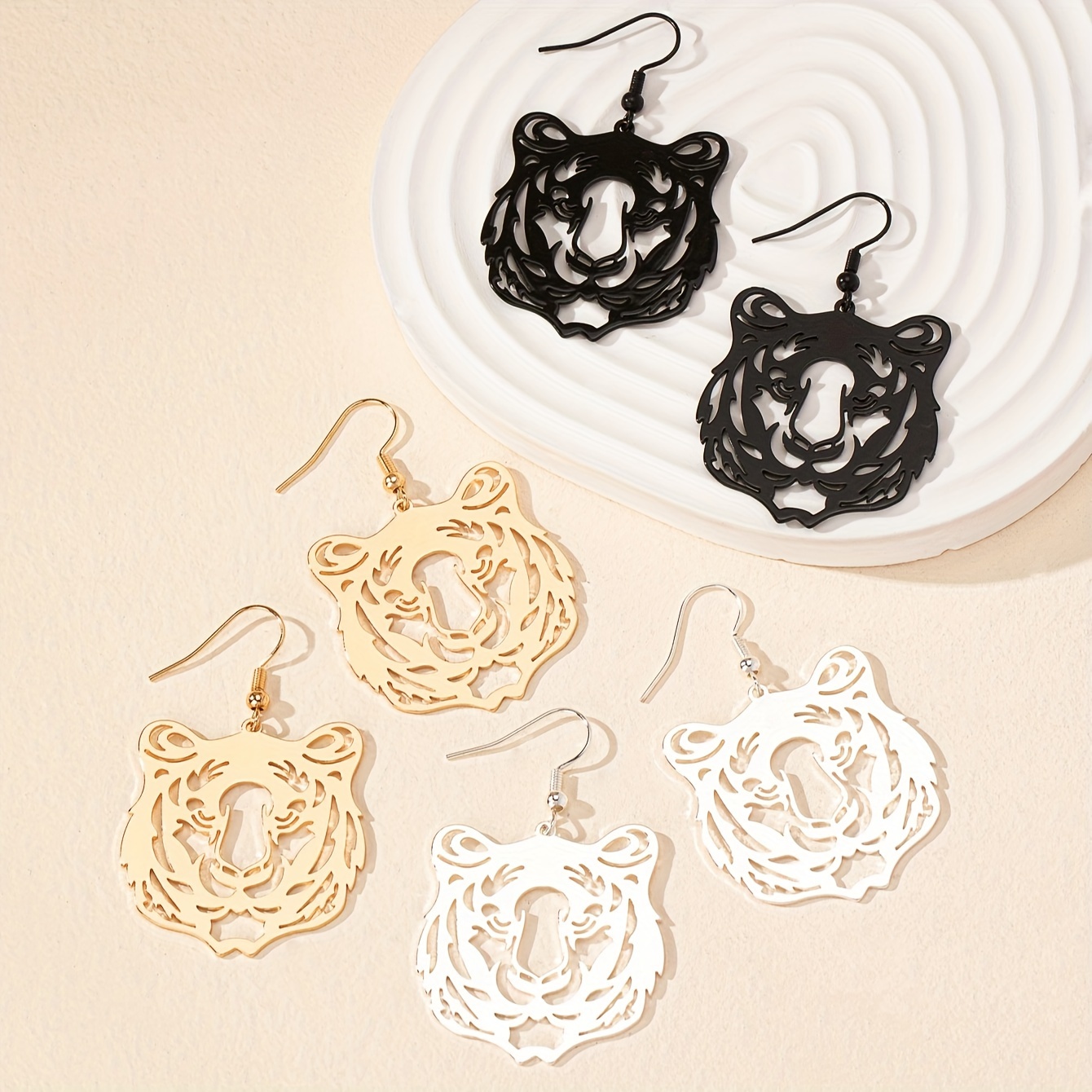 

A Pair Of Trendy Exaggerated And Simple Hollowed-out Golden Tiger Earrings With A Vintage Feel.